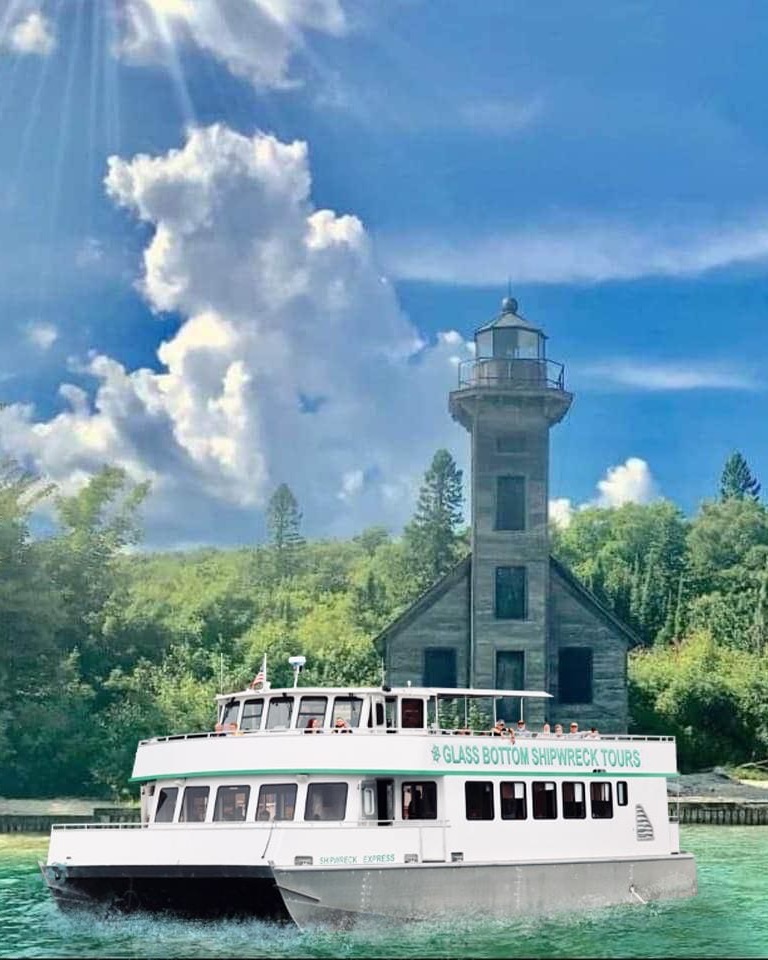 The glass bottom tour boat passing the East Channel Lighthouse on Grand Island