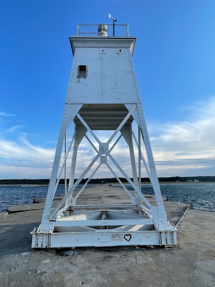 The white light tower at the end of the Grand Marais breakwall