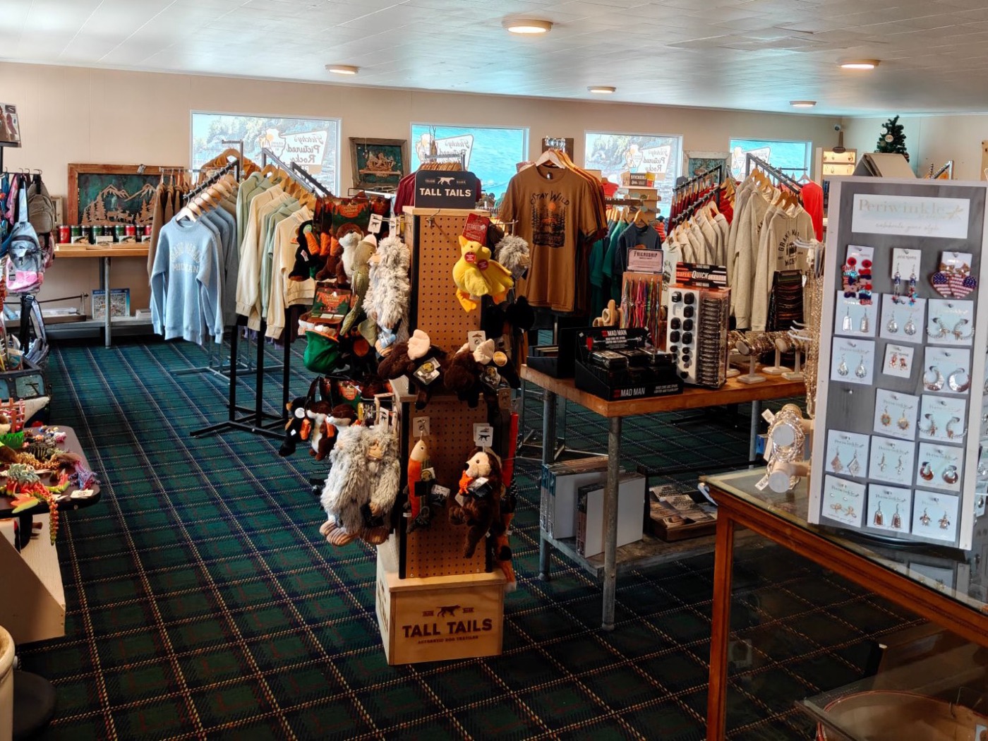 The Fletchy's gift shop: racks of sweatshirts, local jewelry, plush toys and gifts